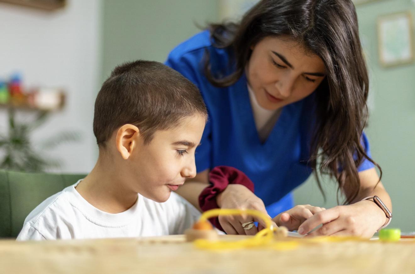 A child receiving support from a care professional