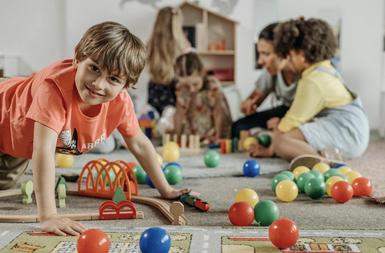 Children playing together in an inclusive activity space